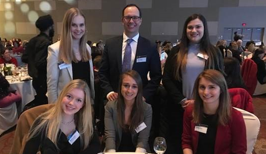 Michael Schaab and Kirsten Nelms (centre) host students at BresciaLEAD Awards Gala.